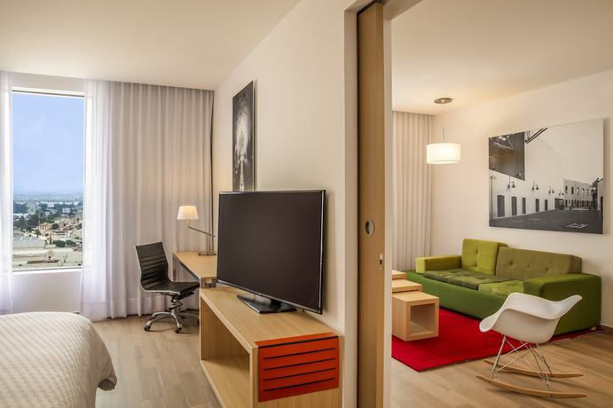 Imagen de la habitación del Hotel Fiesta Inn Parque Puebla. Foto 11