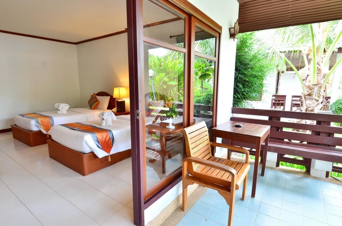 Imagen de la habitación del Hotel First Bungalow Beach Resort. Foto 3