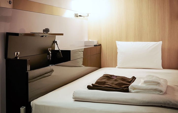Imagen de la habitación del Hotel First Cabin Kyoto Nijojo. Foto 11