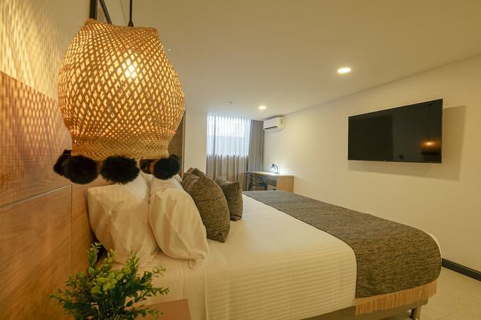 Imagen de la habitación del Hotel First Class. Foto 17