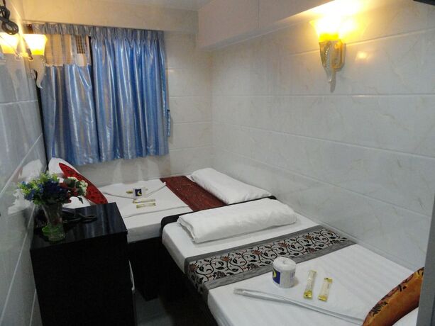 Imagen de la habitación del Hotel First Inn, Kowloon. Foto 19