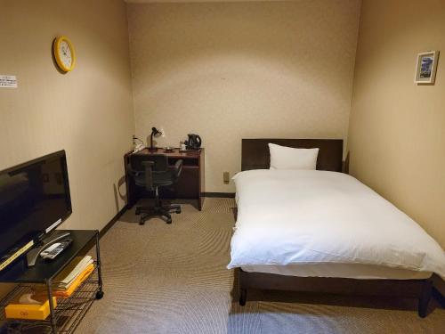 Imagen de la habitación del Hotel First Inn Takamatsu. Foto 18