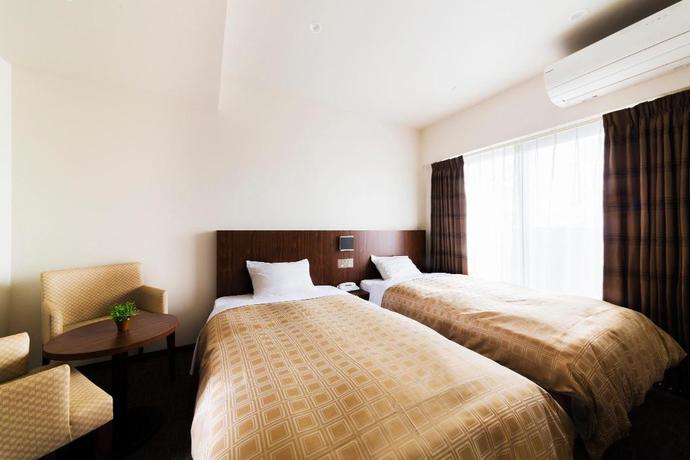 Imagen de la habitación del Hotel First, Izumisano. Foto 20