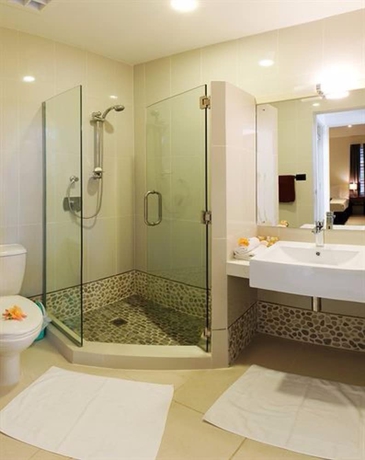Imagen de la habitación del Hotel First Landing Beach Resort and Villas. Foto 12