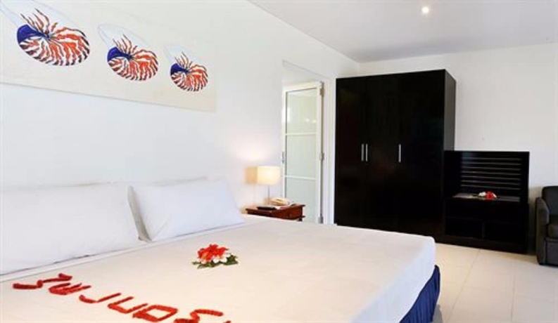 Imagen de la habitación del Hotel First Landing Beach Resort and Villas. Foto 13