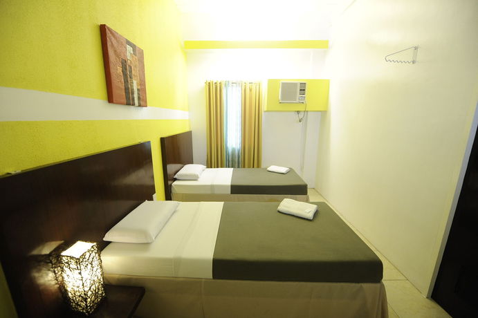 Imagen de la habitación del Hotel First Pacific Inn. Foto 9