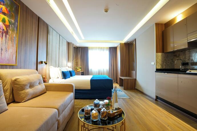 Imagen de la habitación del Hotel First Suites Hôtel. Foto 17