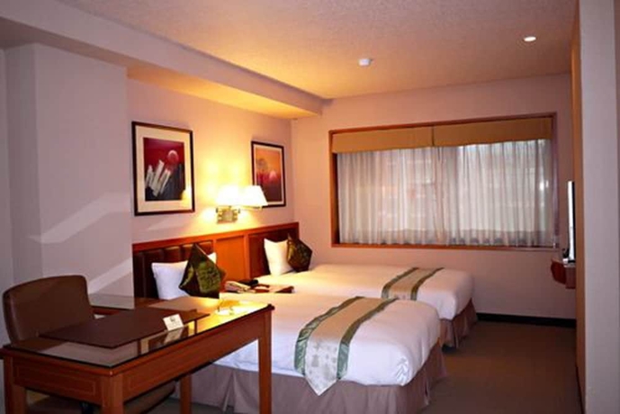 Imagen de la habitación del Hotel First, Taipei. Foto 8