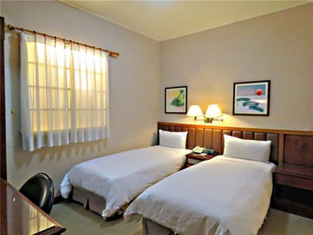 Imagen de la habitación del Hotel First, Taipei. Foto 12