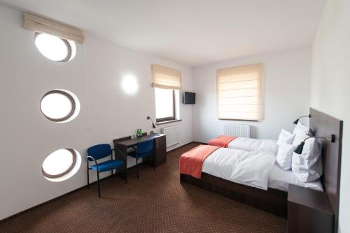 Imagen de la habitación del Hotel First, Tczew. Foto 6