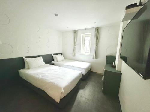 Imagen de la habitación del Hotel Firststay Hongdae. Foto 17