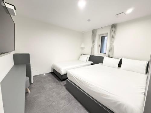Imagen de la habitación del Hotel Firststay Hongdae. Foto 18