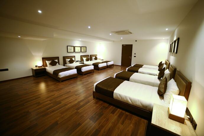 Imagen de la habitación del Hotel Five Petals and Banquets. Foto 18