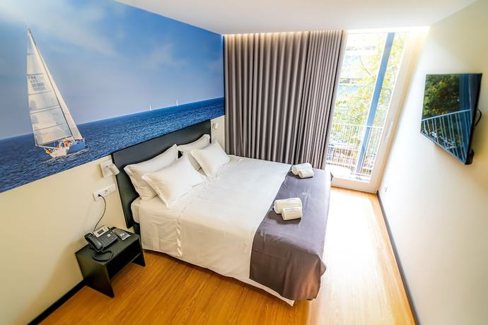 Imagen de la habitación del Hotel Flag Design. Foto 9