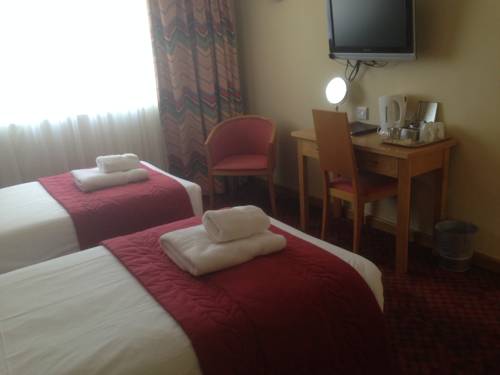 Imagen de la habitación del Hotel Flagship Winford Manor. Foto 13