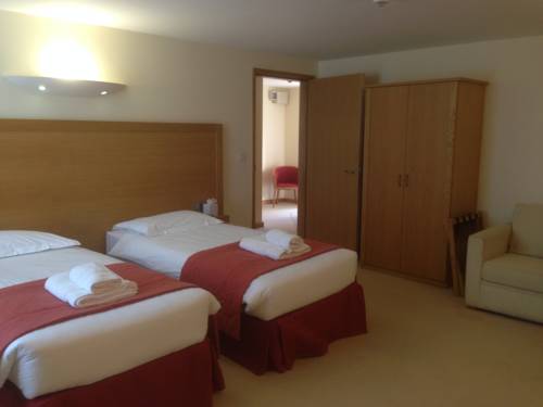 Imagen de la habitación del Hotel Flagship Winford Manor. Foto 15