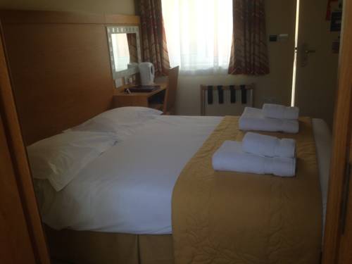 Imagen de la habitación del Hotel Flagship Winford Manor. Foto 17