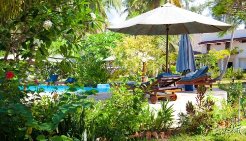 Imagen de los exteriores del Hotel Flame Tree Cottages. Foto 3