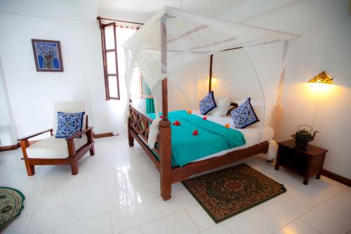Imagen de la habitación del Hotel Flame Tree Cottages. Foto 2