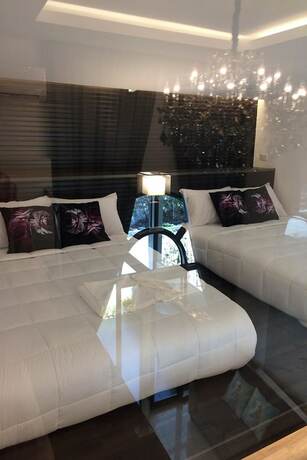 Imagen de la habitación del Hotel Flamingo Villa. Foto 15