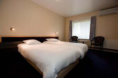 Imagen de la habitación del Hotel Flanders Lodge Hotel. Foto 5