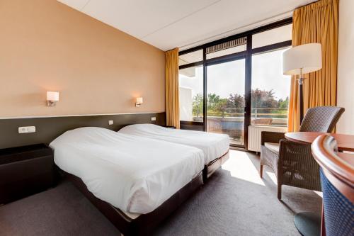 Imagen de la habitación del Hotel Fletcher Frerikshof. Foto 7