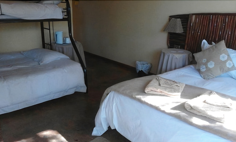 Imagen de la habitación del Hotel Flintstones Guest House Durban. Foto 5