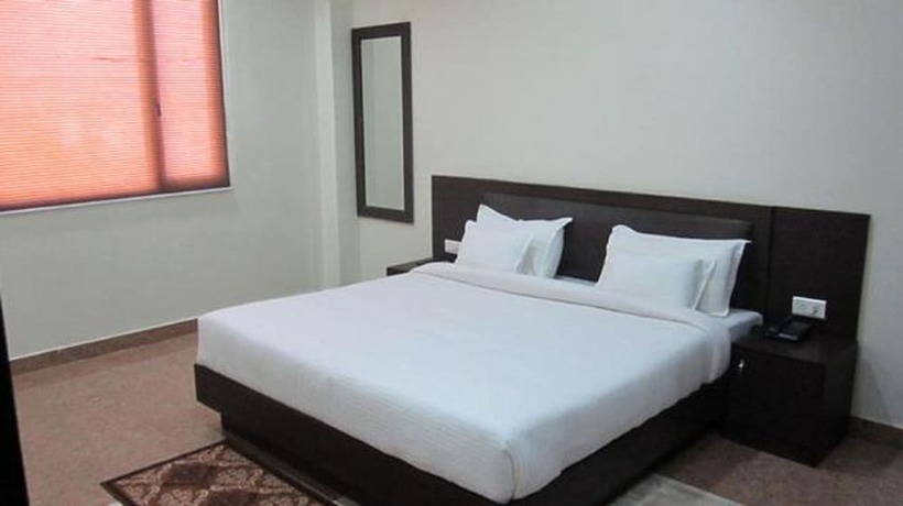 Imagen de la habitación del Hotel Flora Haridwar. Foto 4