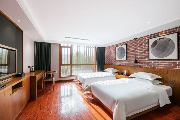 Imagen de la habitación del Hotel Floral Deqing Yingxi Riverside. Foto 13