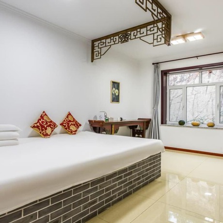 Imagen de la habitación del Hotel Floral He Ping He Yuan Jixian. Foto 10