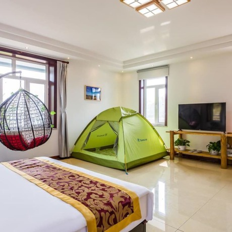 Imagen de la habitación del Hotel Floral He Ping He Yuan Jixian. Foto 11