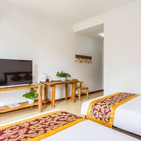 Imagen de la habitación del Hotel Floral He Ping He Yuan Jixian. Foto 12