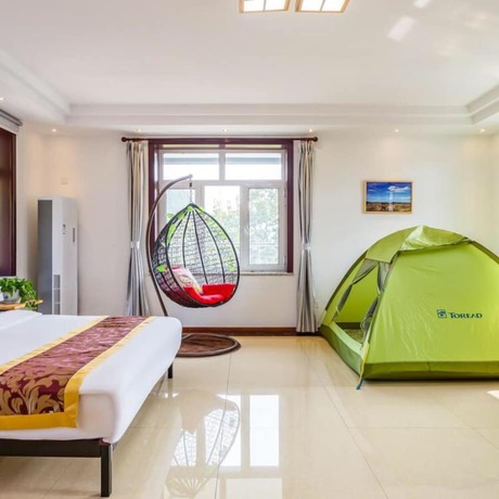 Imagen de la habitación del Hotel Floral He Ping He Yuan Jixian. Foto 15