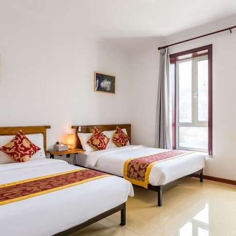 Imagen de la habitación del Hotel Floral He Ping He Yuan Jixian. Foto 16