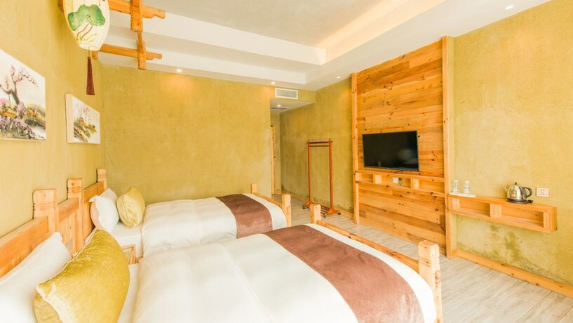 Imagen de la habitación del Hotel Floral Hotel Fenghuang Huercaowu. Foto 4