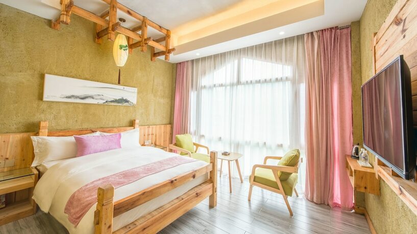 Imagen de la habitación del Hotel Floral Hotel Fenghuang Huercaowu. Foto 5