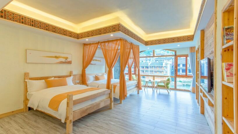 Imagen de la habitación del Hotel Floral Hotel Fenghuang Huercaowu. Foto 8
