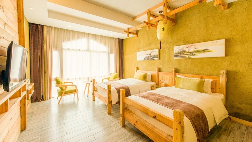 Imagen de la habitación del Hotel Floral Hotel Fenghuang Huercaowu. Foto 9