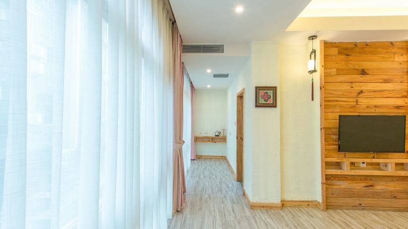 Imagen de la habitación del Hotel Floral Hotel Fenghuang Huercaowu. Foto 10