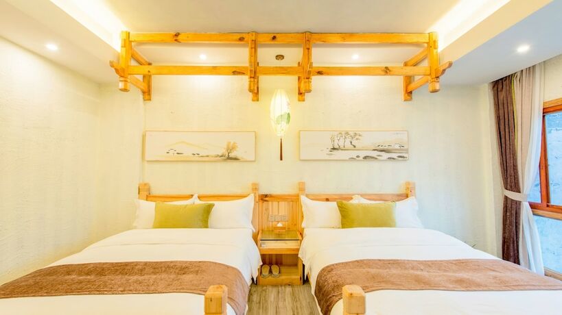 Imagen de la habitación del Hotel Floral Hotel Fenghuang Huercaowu. Foto 11