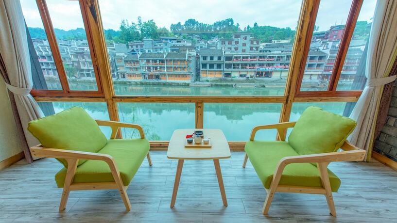 Imagen de la habitación del Hotel Floral Hotel Fenghuang Huercaowu. Foto 12