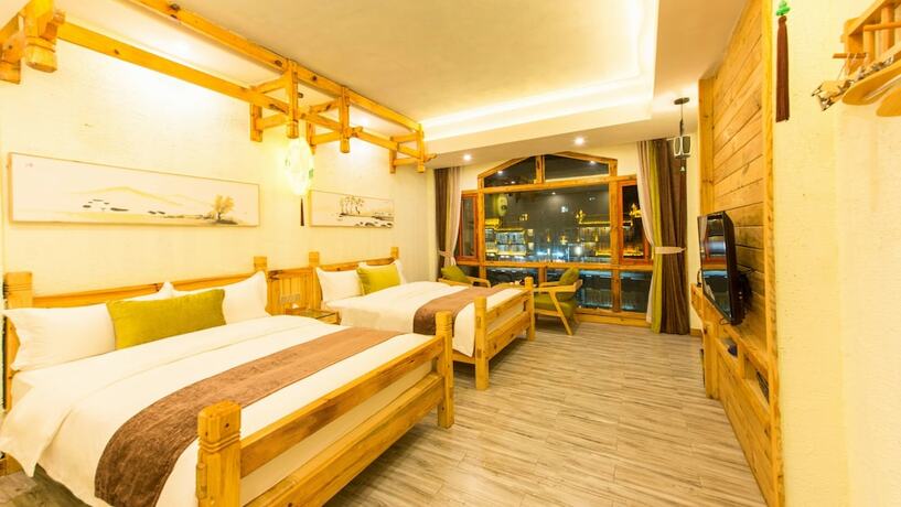 Imagen de la habitación del Hotel Floral Hotel Fenghuang Huercaowu. Foto 13