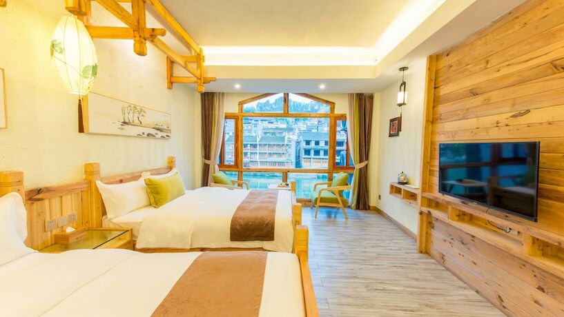 Imagen de la habitación del Hotel Floral Hotel Fenghuang Huercaowu. Foto 15
