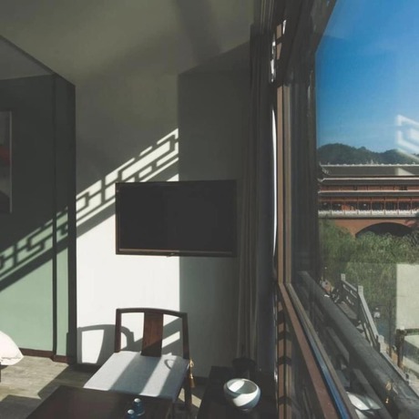 Imagen de la habitación del Hotel Floral Hotel Fenghuang Molan Riverview. Foto 14