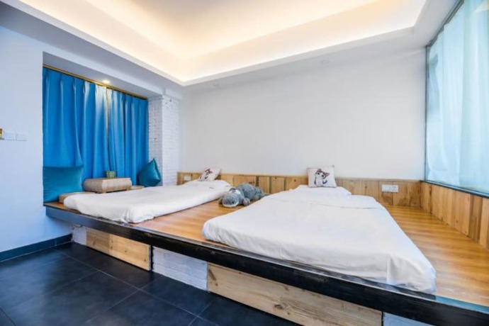 Imagen de la habitación del Hotel Floral Hotel Langzhong Pangmen College. Foto 3