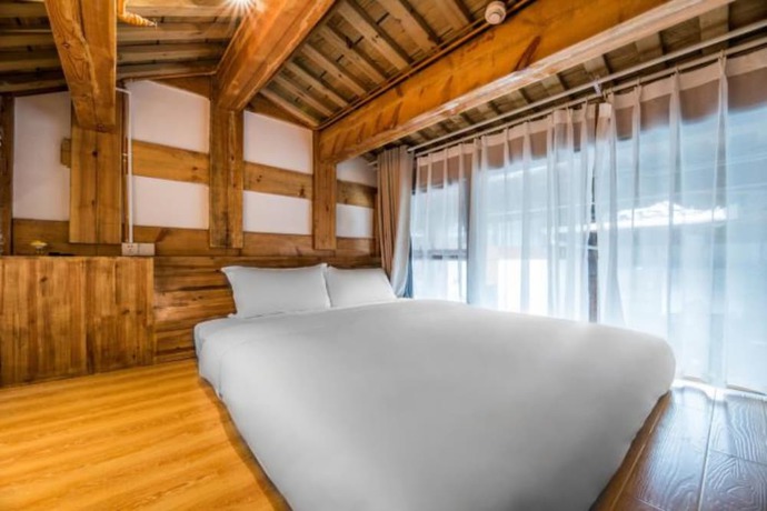 Imagen de la habitación del Hotel Floral Hotel Langzhong Pangmen College. Foto 4