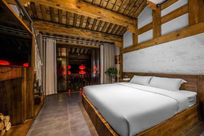 Imagen de la habitación del Hotel Floral Hotel Langzhong Pangmen College. Foto 5