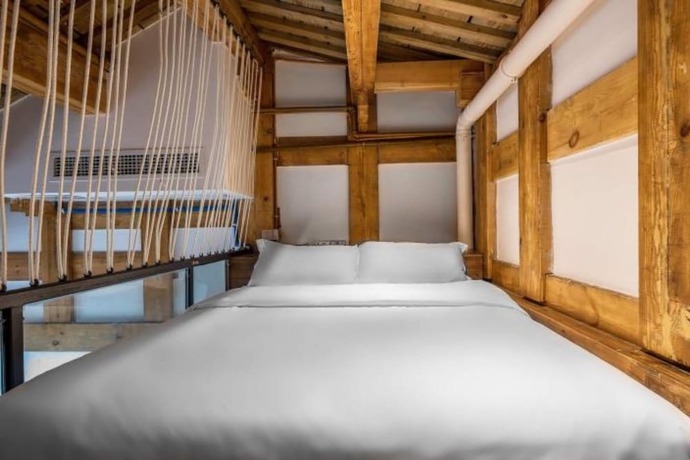 Imagen de la habitación del Hotel Floral Hotel Langzhong Pangmen College. Foto 6