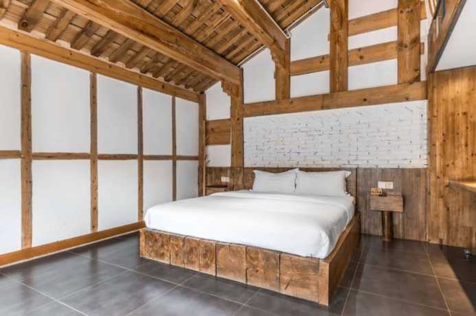 Imagen de la habitación del Hotel Floral Hotel Langzhong Pangmen College. Foto 7