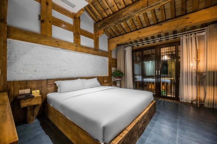 Imagen de la habitación del Hotel Floral Hotel Langzhong Pangmen College. Foto 8